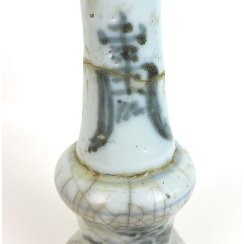 302 - A pair of Chinese Ming style candlesticks, with stepped bases and two tiered columns, each decorated... 