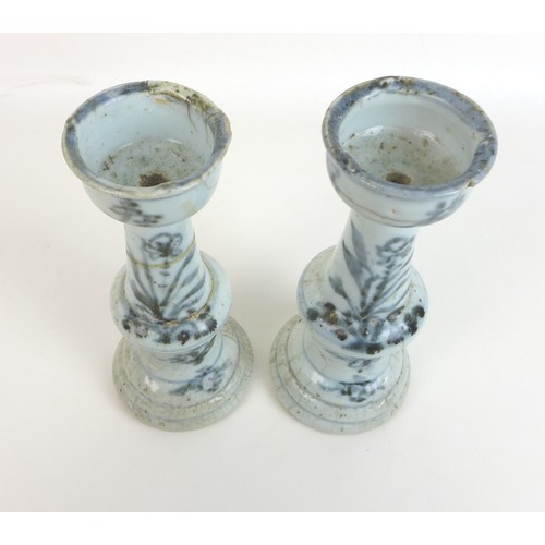 302 - A pair of Chinese Ming style candlesticks, with stepped bases and two tiered columns, each decorated... 