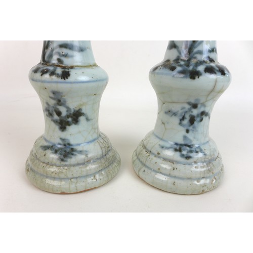 302 - A pair of Chinese Ming style candlesticks, with stepped bases and two tiered columns, each decorated... 