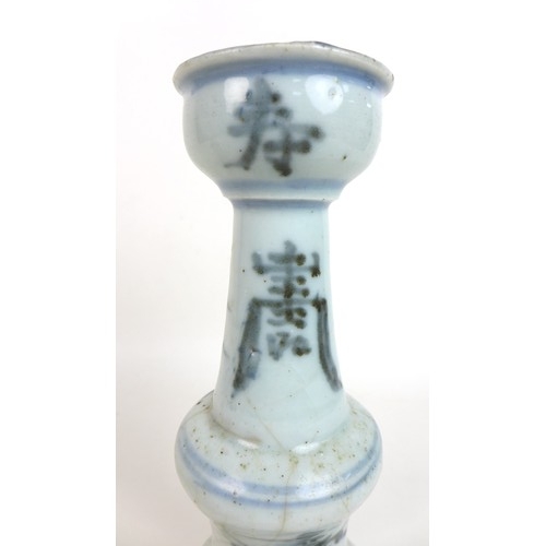 302 - A pair of Chinese Ming style candlesticks, with stepped bases and two tiered columns, each decorated... 