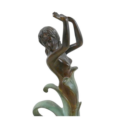 283 - An unsigned 20th century bronze sculpture of a female emerging from curling waves, the waves with gr... 