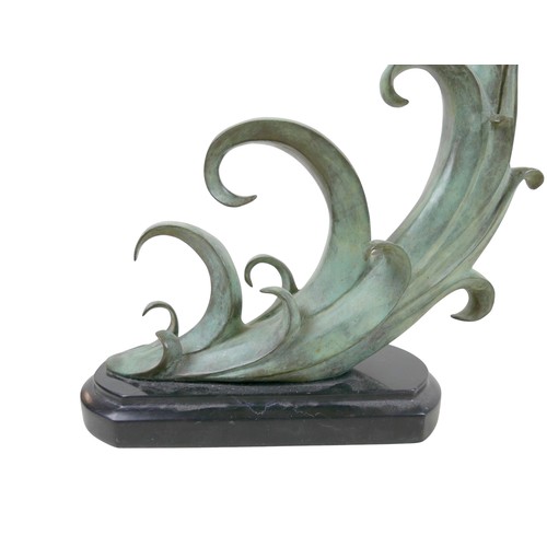 283 - An unsigned 20th century bronze sculpture of a female emerging from curling waves, the waves with gr... 