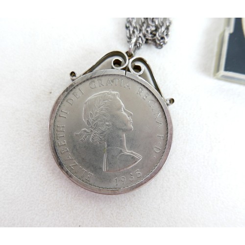 15 - A collection of gilt metal costume jewellery and numismatics, including a 1928 silver dollar pendant... 
