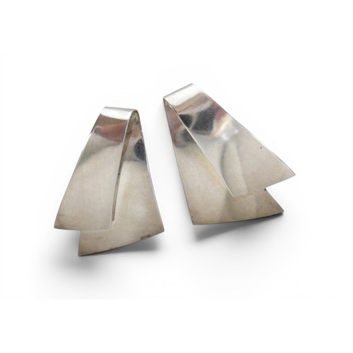 22 - Georg Jensen: A pair of silver earrings, Danish, shaped as folded triangles, 38mm by 25mm, number 20... 