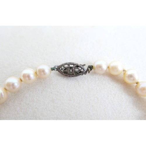 30 - A silver ingot pendant on chain, hallmarked, 40.4g, plus two pearl necklaces; single strand 14cm and... 