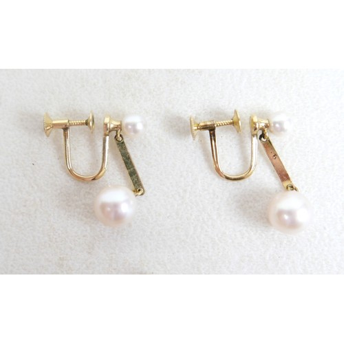30 - A silver ingot pendant on chain, hallmarked, 40.4g, plus two pearl necklaces; single strand 14cm and... 
