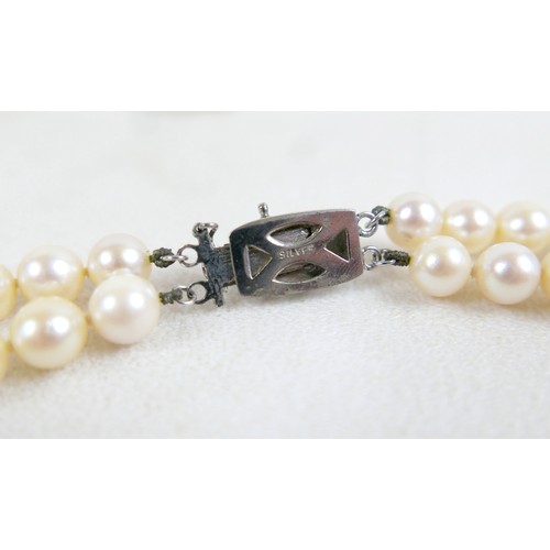 30 - A silver ingot pendant on chain, hallmarked, 40.4g, plus two pearl necklaces; single strand 14cm and... 