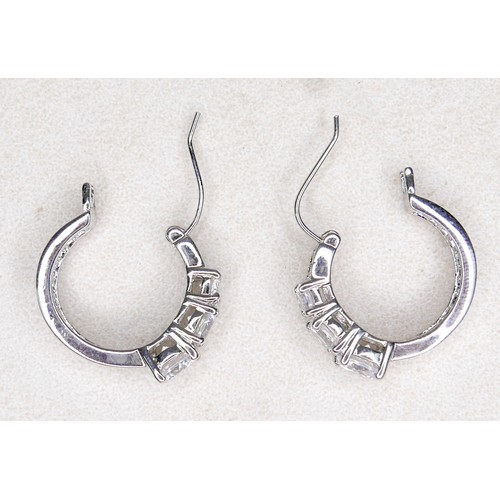 33 - Three white and gilt metal dress rings and a pair of earrings, rings size Q and R.(4)
