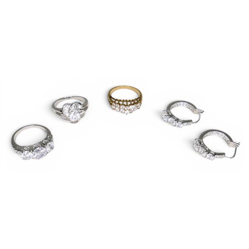 33 - Three white and gilt metal dress rings and a pair of earrings, rings size Q and R.(4)