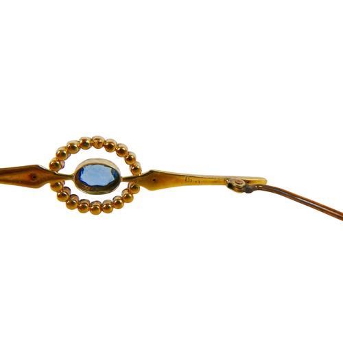 35 - A 15ct gold topaz style stone and seed pearl bar brooch, the oval central stone, approximately 4.5 b... 