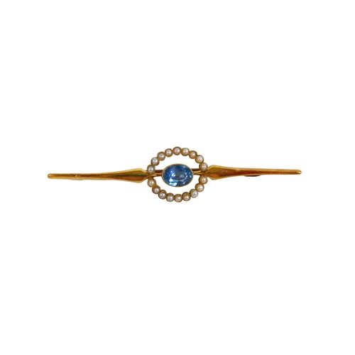 35 - A 15ct gold topaz style stone and seed pearl bar brooch, the oval central stone, approximately 4.5 b... 