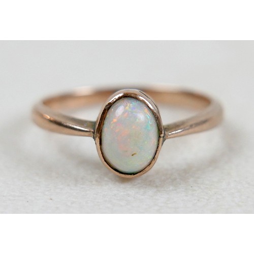 36 - A opal ring with yellow metal band, size M, 1.7g, and a pair of diamond earrings, backs stamped 375,... 