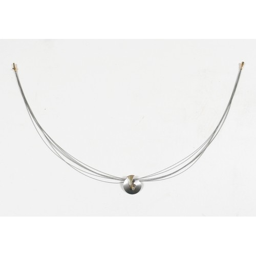 41 - A stainless steel and 14ct yellow gold pedant and necklace, the pendant 2cm high on a seven strand n... 