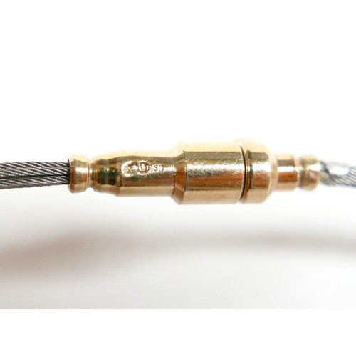 41 - A stainless steel and 14ct yellow gold pedant and necklace, the pendant 2cm high on a seven strand n... 
