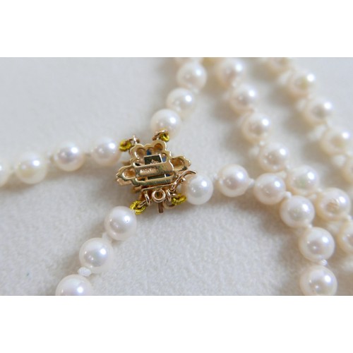 43 - A two-strand pearl necklace, with gold clasp and set with marquise sapphires, 36cm long, together wi... 