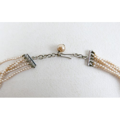 43 - A two-strand pearl necklace, with gold clasp and set with marquise sapphires, 36cm long, together wi... 