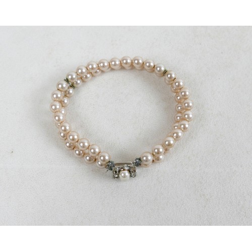 43 - A two-strand pearl necklace, with gold clasp and set with marquise sapphires, 36cm long, together wi... 