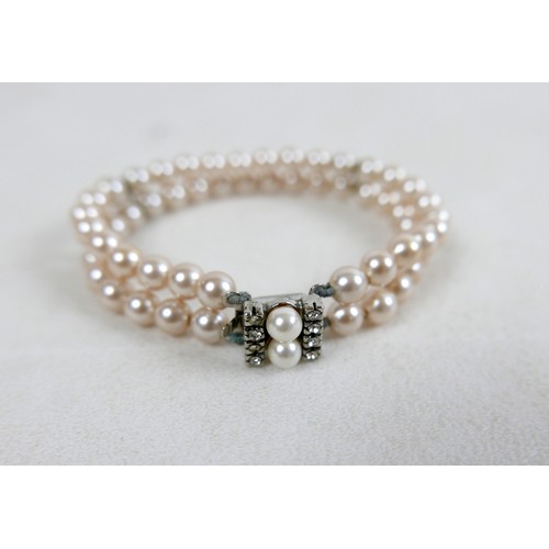 43 - A two-strand pearl necklace, with gold clasp and set with marquise sapphires, 36cm long, together wi... 