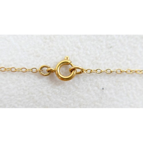 44 - A 9ct gold and smoky quartz pendant on thin gold chain, 48cm long, the central stone a large oval, t... 