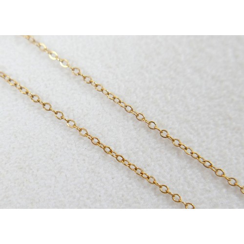 44 - A 9ct gold and smoky quartz pendant on thin gold chain, 48cm long, the central stone a large oval, t... 