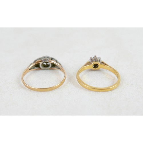 50 - Two 18ct and diamond rings; the first a solitaire diamond with leaf shoulders, size P, 2.3g, the oth... 