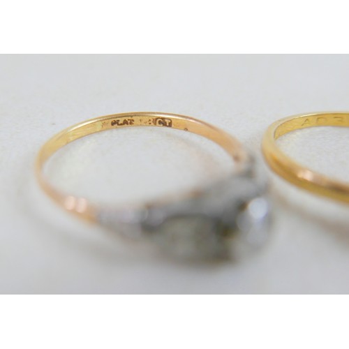 50 - Two 18ct and diamond rings; the first a solitaire diamond with leaf shoulders, size P, 2.3g, the oth... 