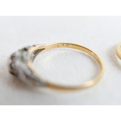 50 - Two 18ct and diamond rings; the first a solitaire diamond with leaf shoulders, size P, 2.3g, the oth... 