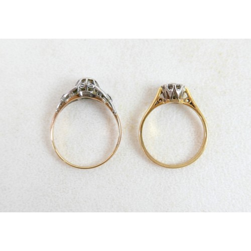 50 - Two 18ct and diamond rings; the first a solitaire diamond with leaf shoulders, size P, 2.3g, the oth... 
