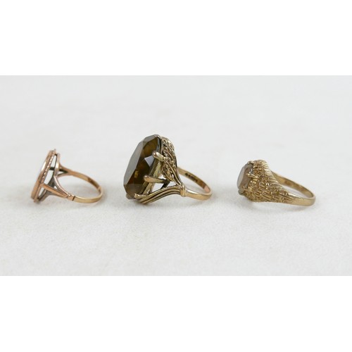 54 - Two 9ct and smoky quartz rings; one with large oval stone and leaf detail, size M, 8.7g, the other w... 