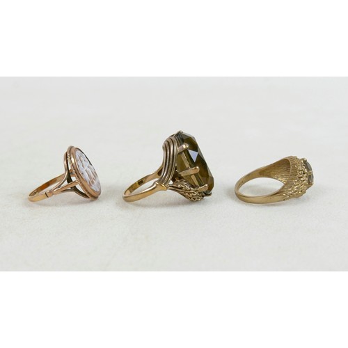 54 - Two 9ct and smoky quartz rings; one with large oval stone and leaf detail, size M, 8.7g, the other w... 