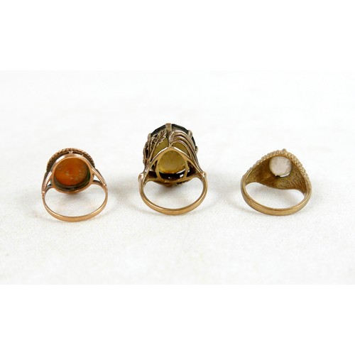 54 - Two 9ct and smoky quartz rings; one with large oval stone and leaf detail, size M, 8.7g, the other w... 