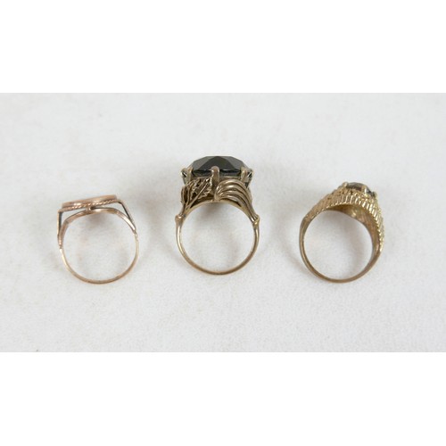 54 - Two 9ct and smoky quartz rings; one with large oval stone and leaf detail, size M, 8.7g, the other w... 
