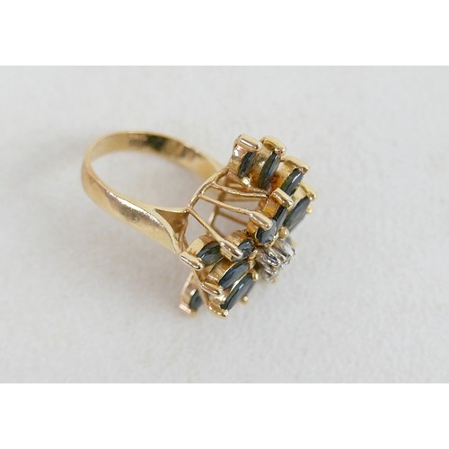 57 - A large 14k gold, sapphire and diamond dress ring, marked 585, with flowerhead of marquise cut sapph... 