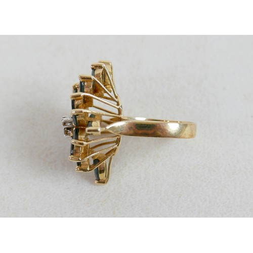 57 - A large 14k gold, sapphire and diamond dress ring, marked 585, with flowerhead of marquise cut sapph... 