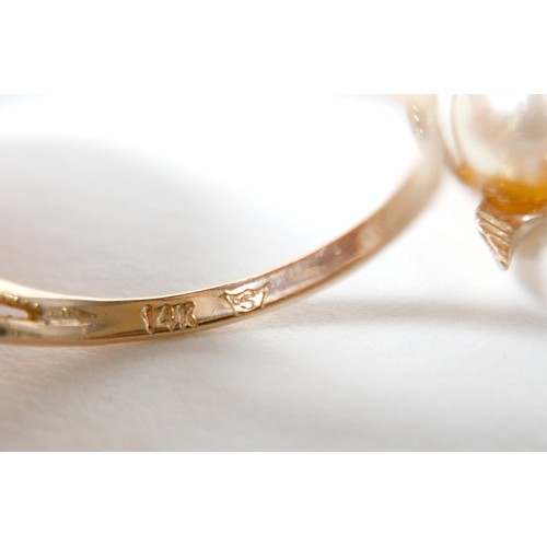 58 - A 14k gold and single pearl ring with flower detail, 3.3g, size P, plus a matching 10k gold and pear... 