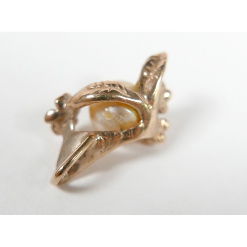 58 - A 14k gold and single pearl ring with flower detail, 3.3g, size P, plus a matching 10k gold and pear... 