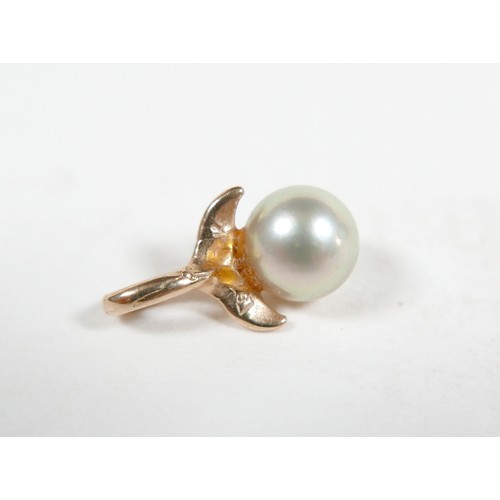 58 - A 14k gold and single pearl ring with flower detail, 3.3g, size P, plus a matching 10k gold and pear... 