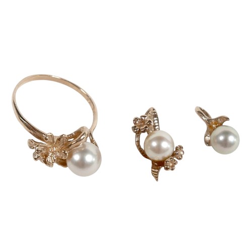 58 - A 14k gold and single pearl ring with flower detail, 3.3g, size P, plus a matching 10k gold and pear... 
