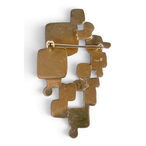 5 - An 18ct yellow gold abstract design brooch part textured marked NM, 57 by 32mm, 15.2g.