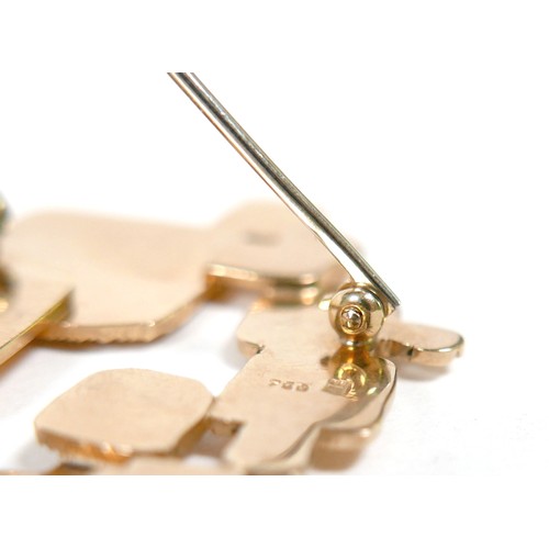 5 - An 18ct yellow gold abstract design brooch part textured marked NM, 57 by 32mm, 15.2g.