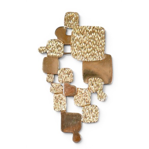5 - An 18ct yellow gold abstract design brooch part textured marked NM, 57 by 32mm, 15.2g.