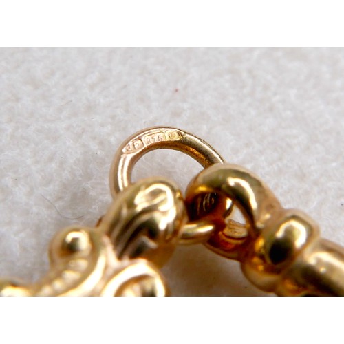 11 - A 9ct gold double chain necklace with lobster clasps, heart and wholly leaf shaped sections, tassel ... 