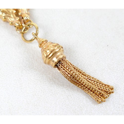 11 - A 9ct gold double chain necklace with lobster clasps, heart and wholly leaf shaped sections, tassel ... 