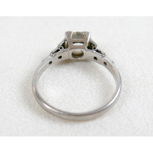 4 - An Art Deco diamond ring, the central stone approxmately 0.8ct old European/old mine cut in square s... 