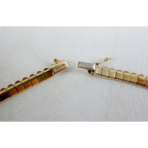 10 - An Italian 14k gold Oritals graduated flat fringe necklace, 42cm, 27.1g.