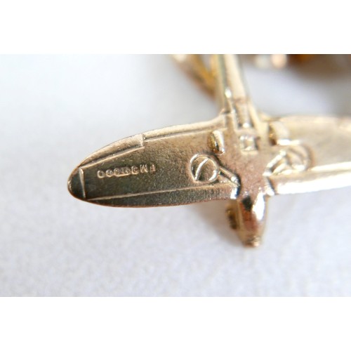 8 - A 9ct gold charm bracelet with assorted charms and a Victoria, veiled head, 1896 half sovereign, 63.... 