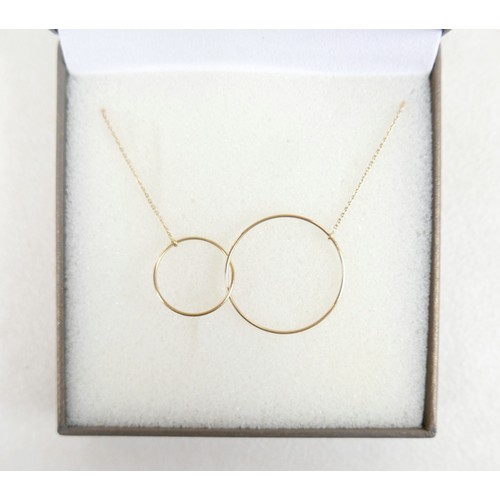37A - An 18ct gold necklace with two hoop design on thin chain, 2.4g.