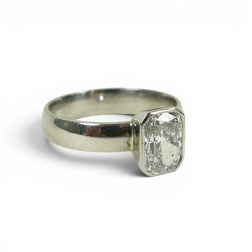 DIAMOND AND PLATINUM SOLITAIRE RING. the emerald cut diamond ...