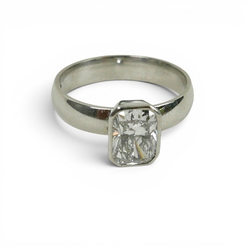 DIAMOND AND PLATINUM SOLITAIRE RING. the emerald cut diamond ...
