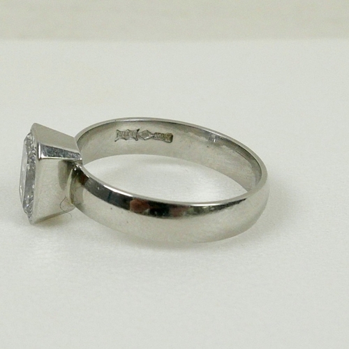 DIAMOND AND PLATINUM SOLITAIRE RING. the emerald cut diamond ...